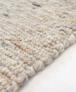 Alfombra de lana tejida a mano Ylva - Beige/Gris - close up zijkant, thumbnail Alfombra de lana tejida a mano Ylva - Beige/Gris - close up zijkant, thumbnail