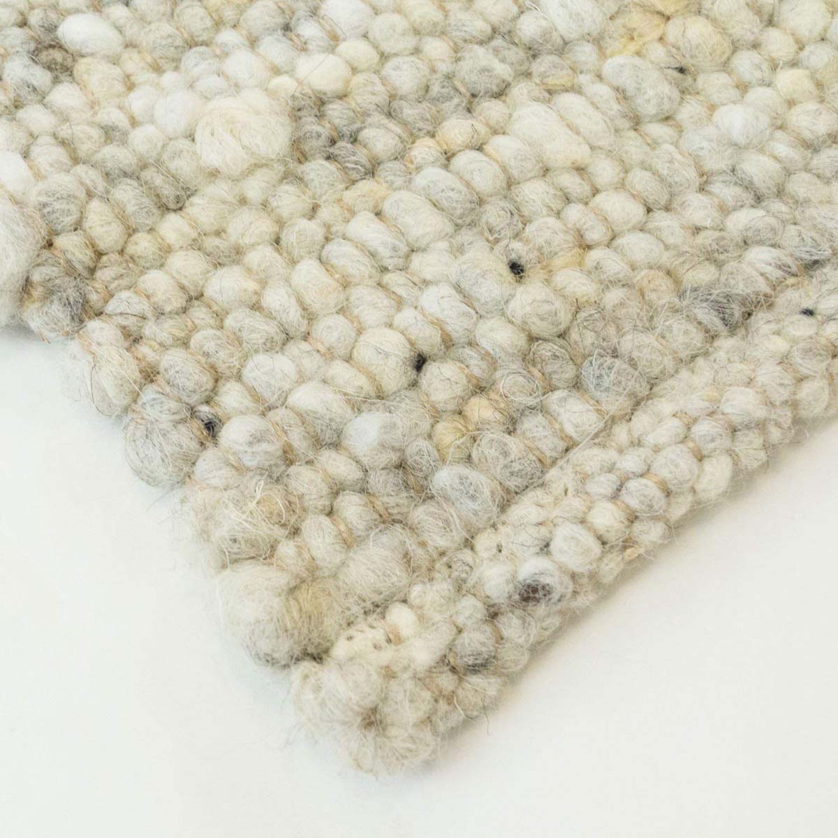 Alfombra de lana tejida a mano Veve - Beige/Gris - close up hoek Alfombra de lana tejida a mano Veve - Beige/Gris - close up hoek