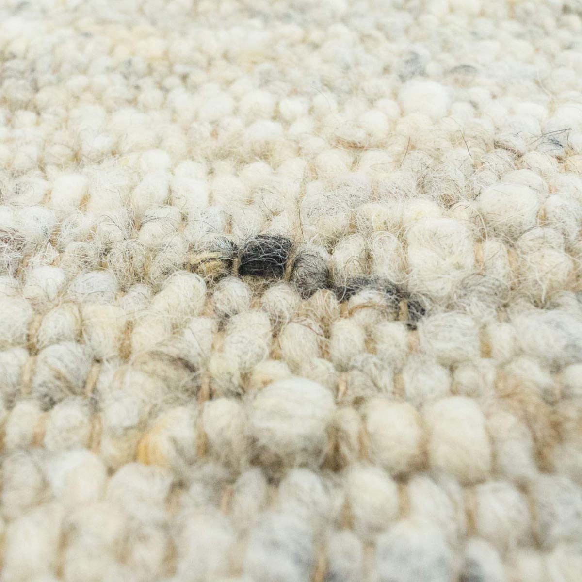Alfombra de lana tejida a mano Veve - Beige/Gris - close up materiaal Alfombra de lana tejida a mano Veve - Beige/Gris - close up materiaal