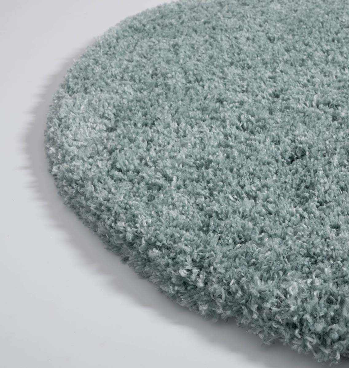 Alfombra redonda de pelo largo - Cozy Shaggy - Azul claro - close up zijkant Alfombra redonda de pelo largo - Cozy Shaggy - Azul claro - close up zijkant