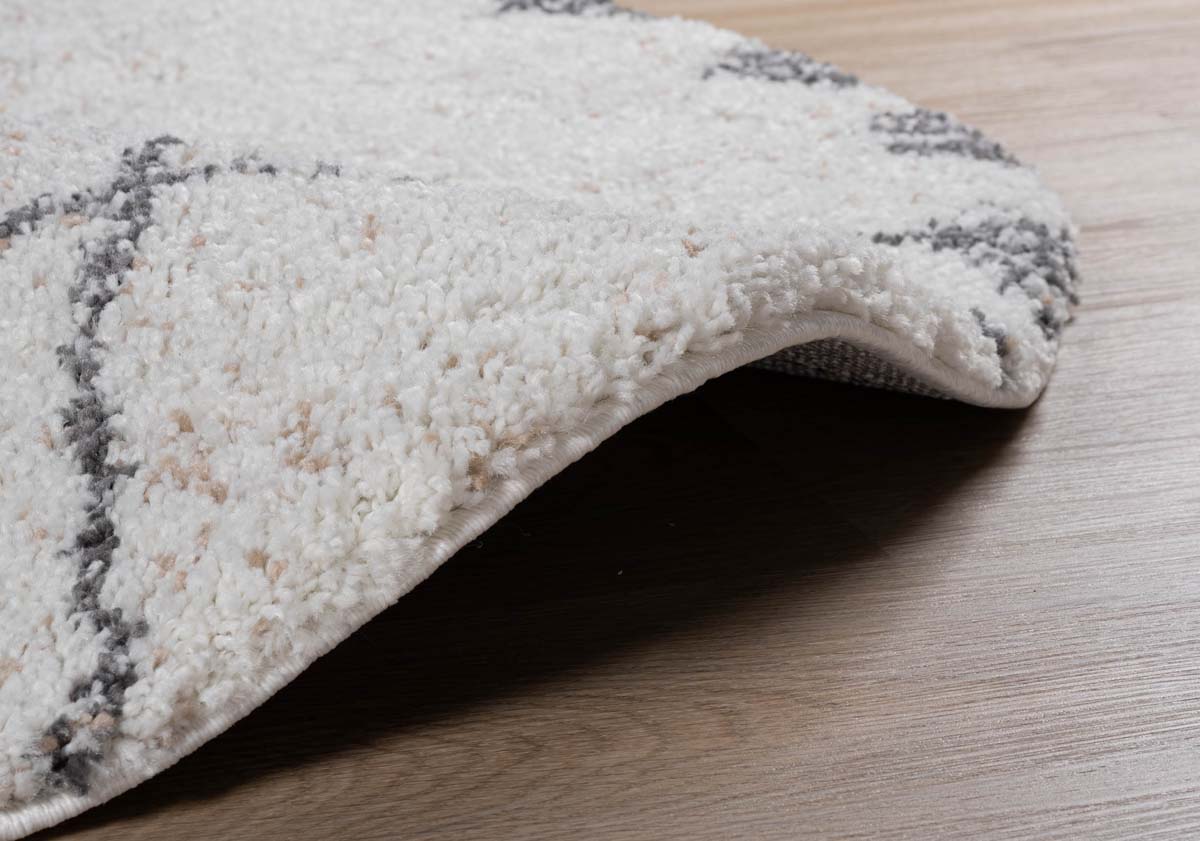Alfombra bereber redonda de pelo largo Artisan - Blanco/Gris - close up zijkant Alfombra bereber redonda de pelo largo Artisan - Blanco/Gris - close up zijkant