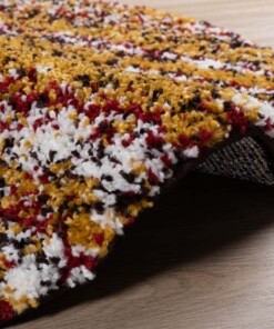 Alfombra redonda de pelo largo a rayas Artisan - Multicolor/Amarillo mostaza - close up zijkant, thumbnail Alfombra redonda de pelo largo a rayas Artisan - Multicolor/Amarillo mostaza - close up zijkant, thumbnail