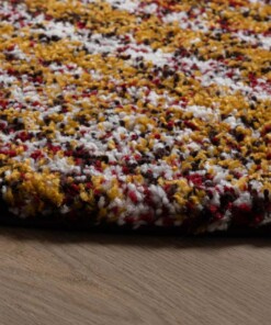 Alfombra redonda de pelo largo a rayas Artisan - Multicolor/Amarillo mostaza - close up zijkant, thumbnail Alfombra redonda de pelo largo a rayas Artisan - Multicolor/Amarillo mostaza - close up zijkant, thumbnail