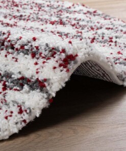 Alfombra redonda de pelo largo con topos Artisan - Gris/Rojo - close up zijkant, thumbnail Alfombra redonda de pelo largo con topos Artisan - Gris/Rojo - close up zijkant, thumbnail