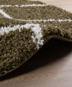 Alfombra redonda a rombos de pelo largo Habitat - Verde Oliva/Blanco - close up zijkant, thumbnail Alfombra redonda a rombos de pelo largo Habitat - Verde Oliva/Blanco - close up zijkant, thumbnail