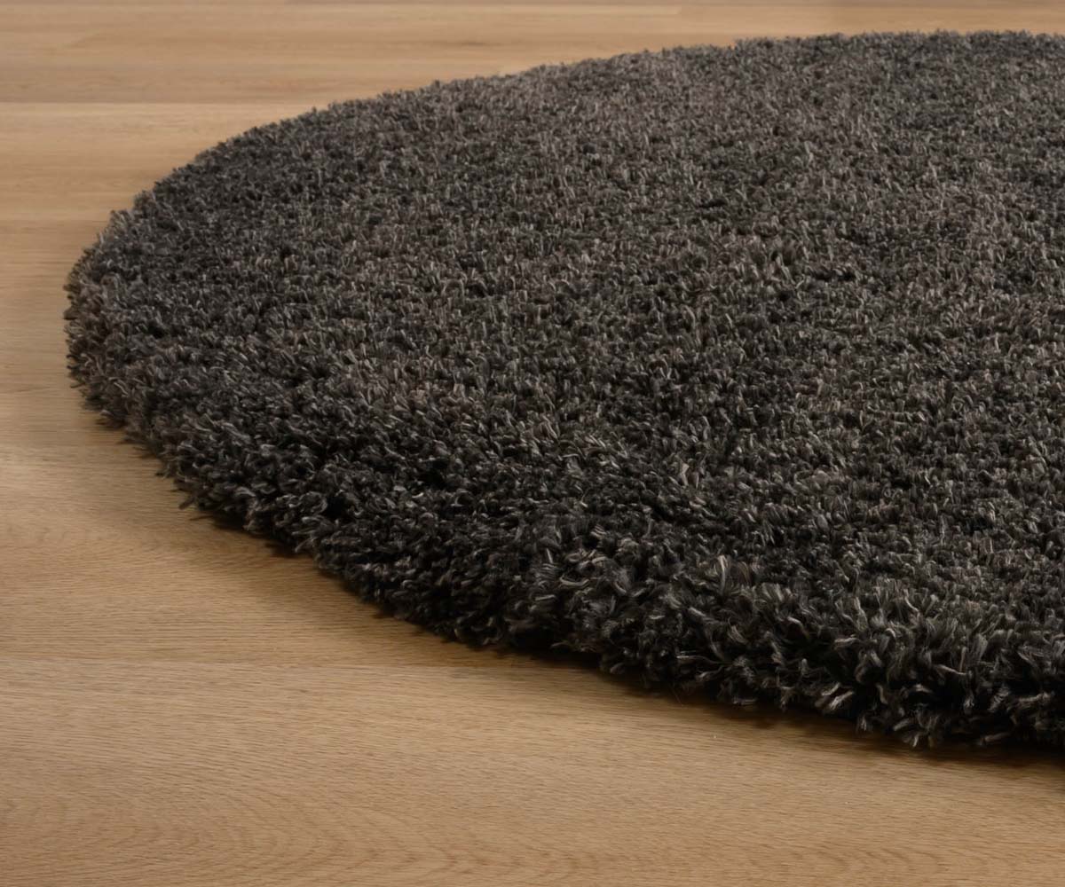 Alfombra ovalada de pelo largo - Acogedora Shaggy Gris Oscuro - close up zijkant Alfombra ovalada de pelo largo - Acogedora Shaggy Gris Oscuro - close up zijkant