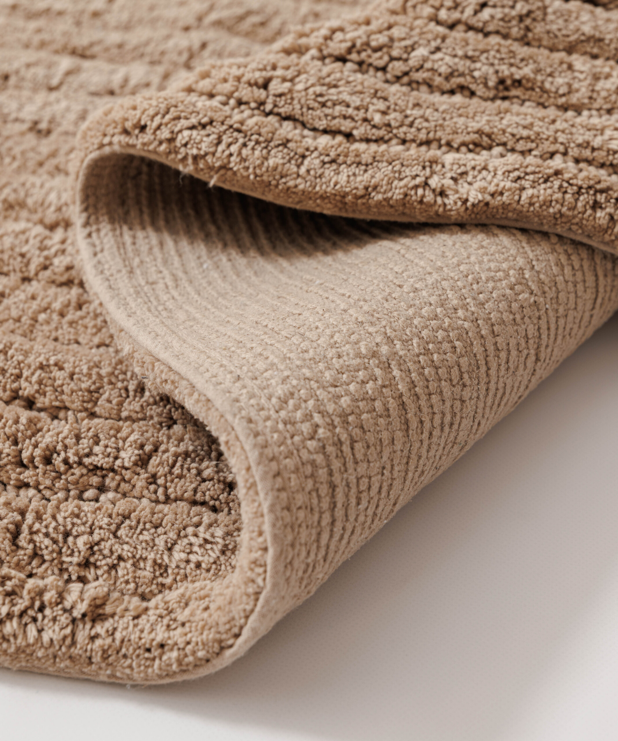 Ovale Badematte - Stille Beige - close up Ovale Badematte - Stille Beige - close up